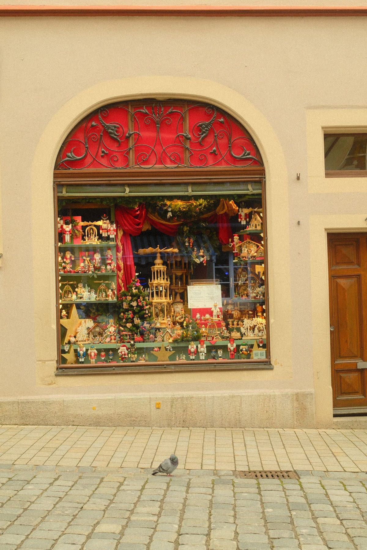 A Christmas shopfront decorated with wreaths in Rothenburg ob der Tauber, Germany